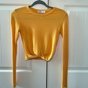 Light weight long sleeve cropped cross front design.